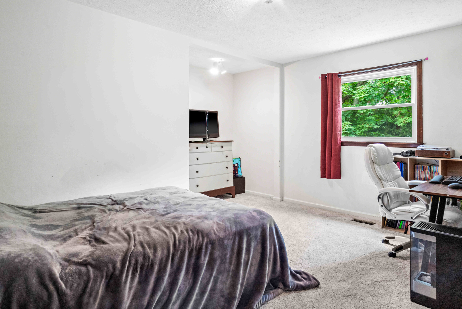 108 Cardinal Drive Le Roy, IL 61752 - Photo 18 of 33 a bedroom with a bed and a flat screen tv