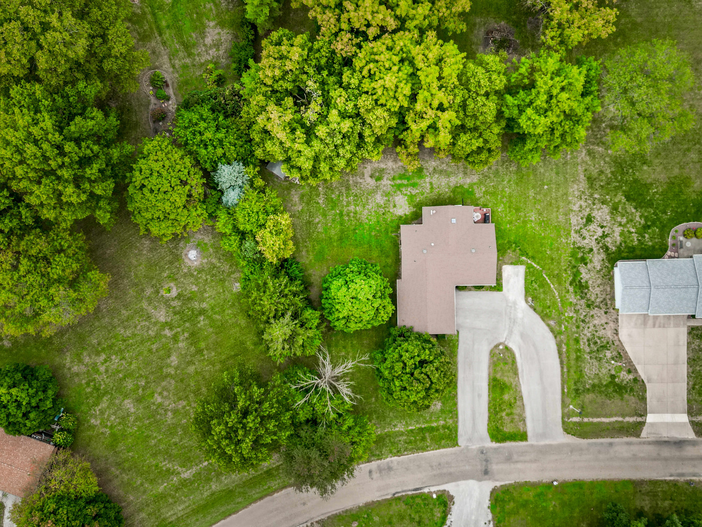 108 Cardinal Drive Le Roy, IL 61752 - Photo 30 of 33 an aerial view of a house with a yard and trees