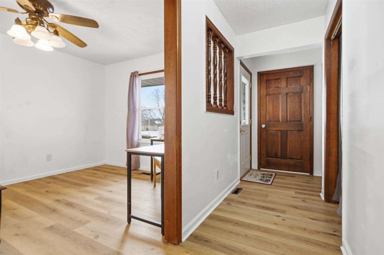108 Cardinal Drive Le Roy, IL 61752 - Photo 3 of 33 a view of a hallway with wooden floor and staircase