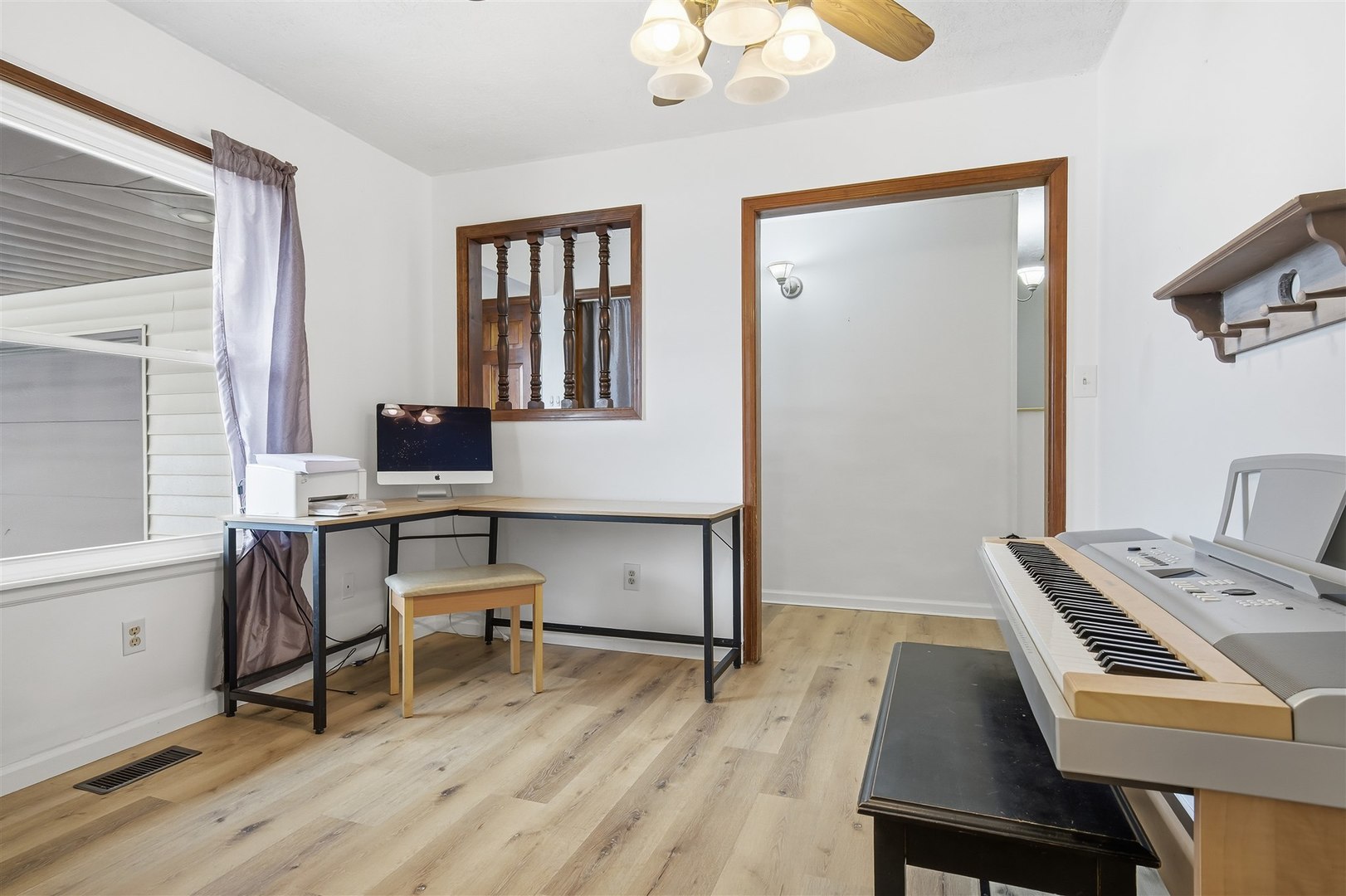 108 Cardinal Drive Le Roy, IL 61752 - Photo 5 of 33 a workspace with furniture and wooden floor