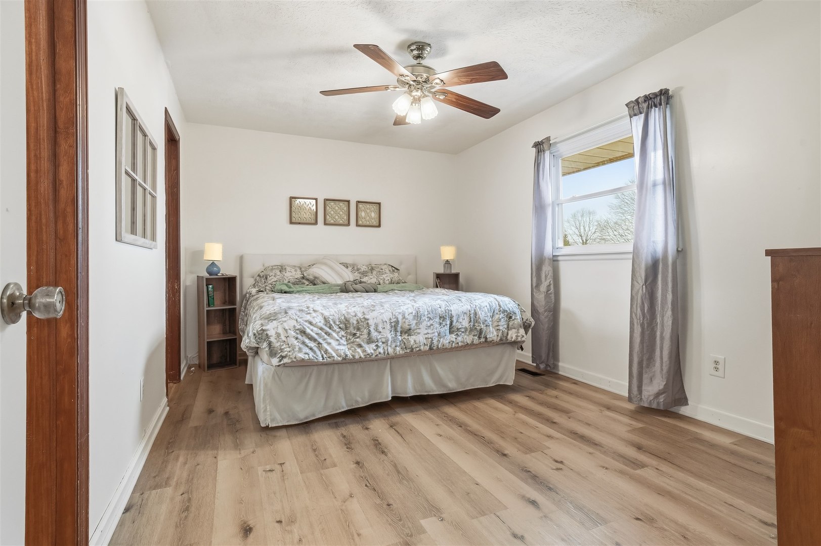 108 Cardinal Drive Le Roy, IL 61752 - Photo 6 of 33 a bedroom with a bed and a ceiling fan