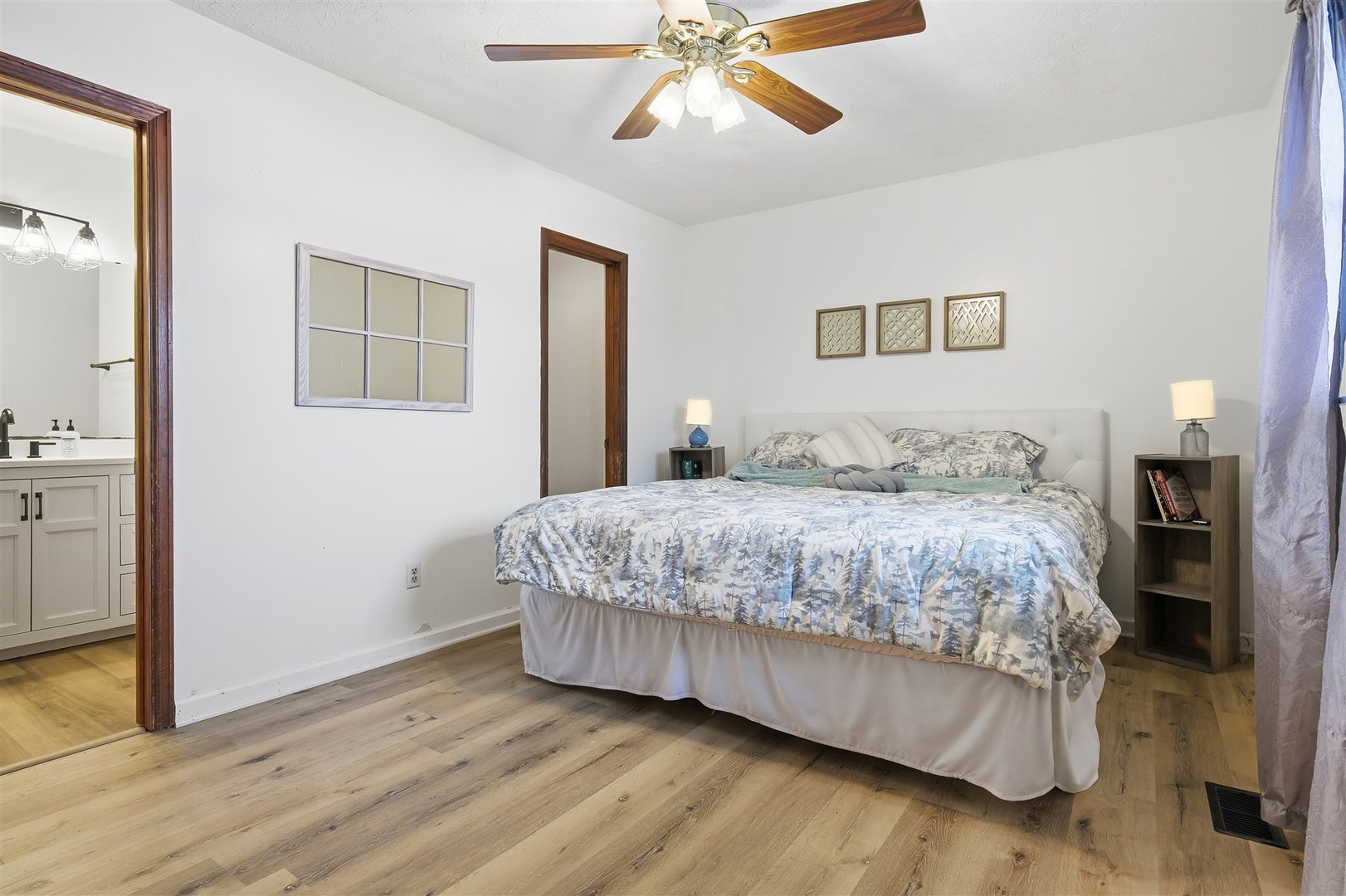 108 Cardinal Drive Le Roy, IL 61752 - Photo 7 of 33 a bedroom with a bed and a chandelier