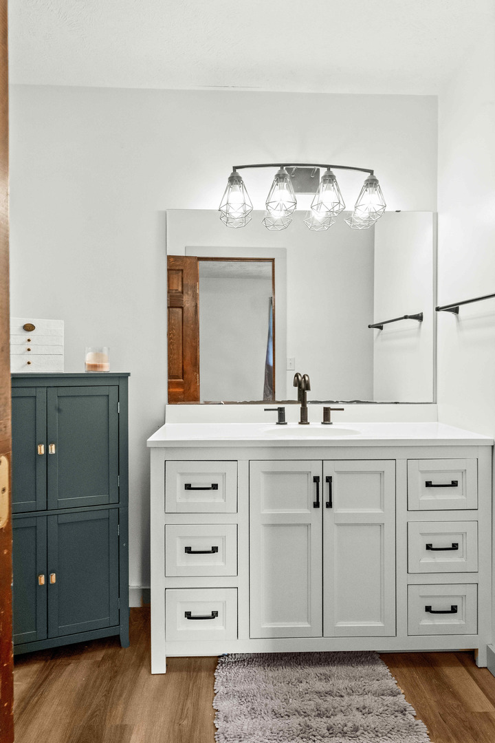 108 Cardinal Drive Le Roy, IL 61752 - Photo 8 of 33 a bathroom with a sink vanity and mirror