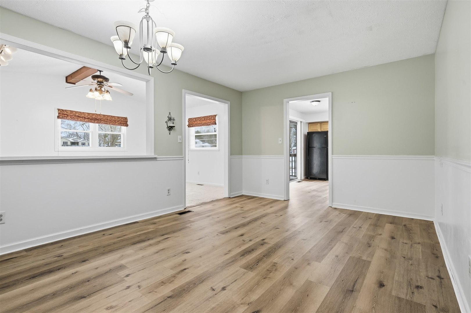 108 Cardinal Drive Le Roy, IL 61752 - Photo 10 of 33 a view of empty room with wooden floor and window