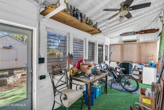 a table and chairs in front of a house