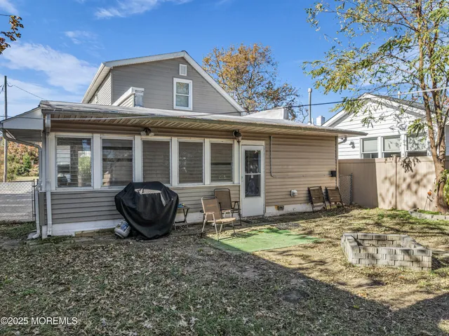 a house with wooden fence