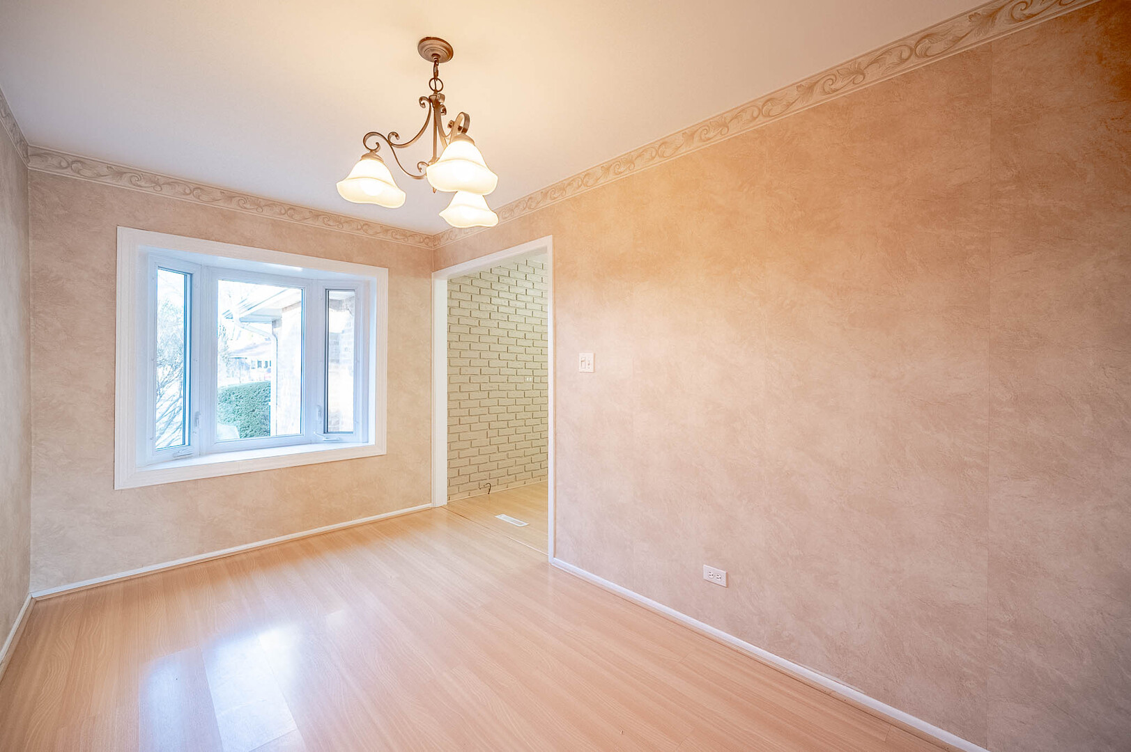 5919 West 109th Street Chicago Ridge, IL 60415 - Photo 3 of 14 a view of an empty room with wooden floor and a window
