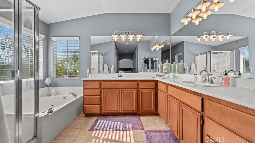19829 Adirondack Lane Riverside, CA 92508 - Photo 13 of 34 a spacious bathroom with a bathtub sink and a mirror