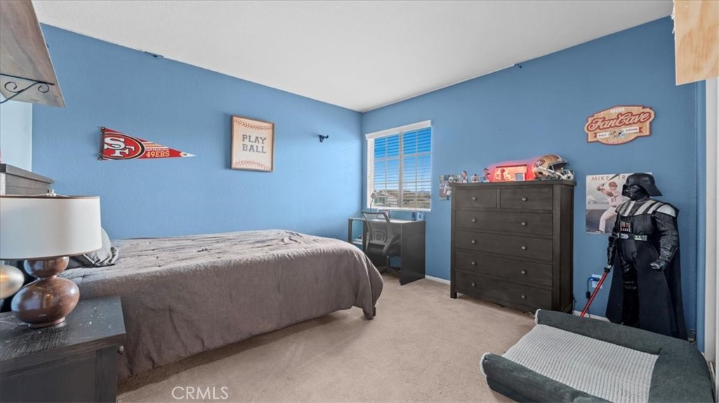 19829 Adirondack Lane Riverside, CA 92508 - Photo 15 of 34 a bedroom with a bed and a lamp