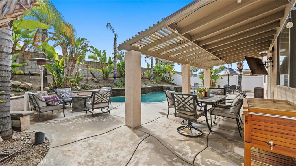 19829 Adirondack Lane Riverside, CA 92508 - Photo 17 of 34 a view of a patio with table and chairs and potted plants