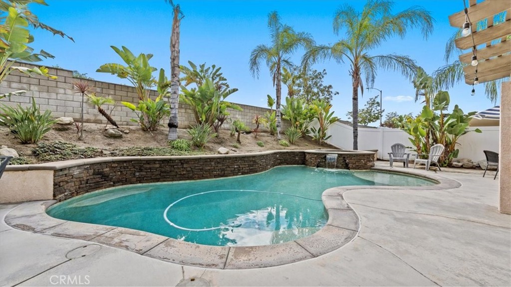 19829 Adirondack Lane Riverside, CA 92508 - Photo 19 of 34 a view of a swimming pool with a yard