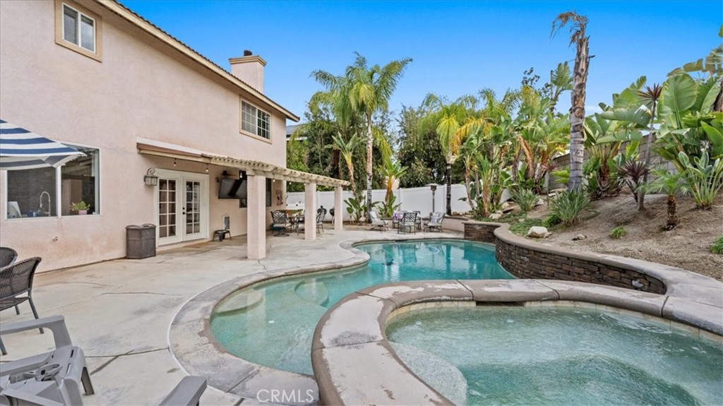 19829 Adirondack Lane Riverside, CA 92508 - Photo 21 of 34 a view of a swimming pool with a patio