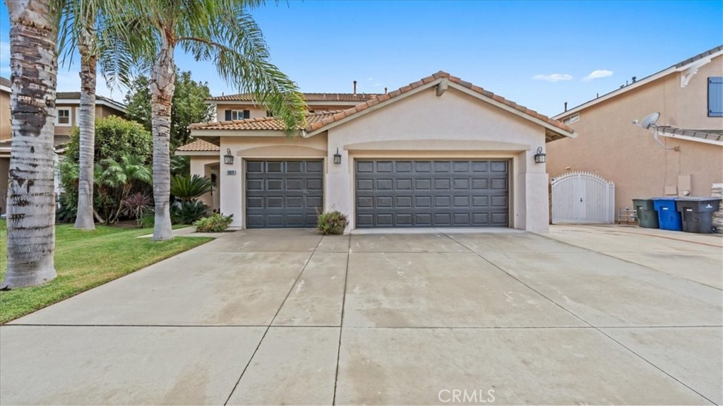 19829 Adirondack Lane Riverside, CA 92508 - Photo 3 of 34 a view of a house with a yard and garage