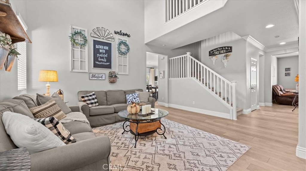 19829 Adirondack Lane Riverside, CA 92508 - Photo 4 of 34 a living room with furniture and wooden floor