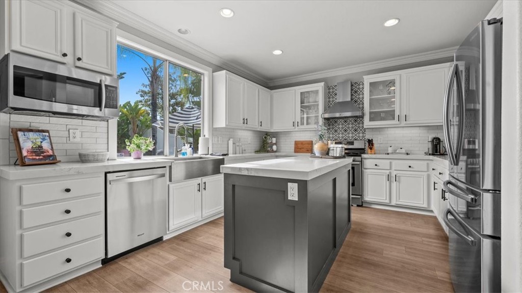 19829 Adirondack Lane Riverside, CA 92508 - Photo 6 of 34 a kitchen with cabinets appliances a sink and a window
