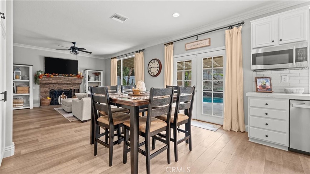 19829 Adirondack Lane Riverside, CA 92508 - Photo 7 of 34 a view of a dining room with furniture window and wooden floor