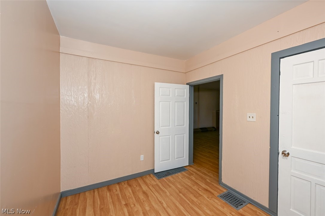 868 North Main Street Akron, OH 44310 - Photo 25 of 30 Unfurnished room with light wood-style flooring and baseboards
