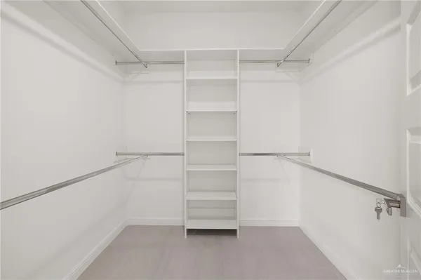 a view of an empty walk in closet