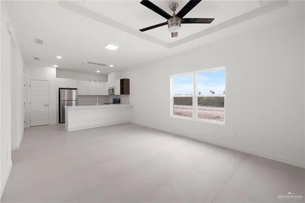 a view of a kitchen with a sink cabinets and window