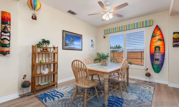 a view of a kitchen with wooden floor and a sink