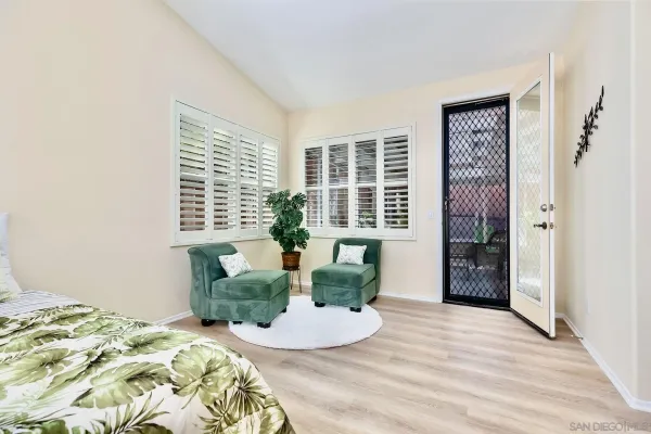 a bedroom with furniture and a window