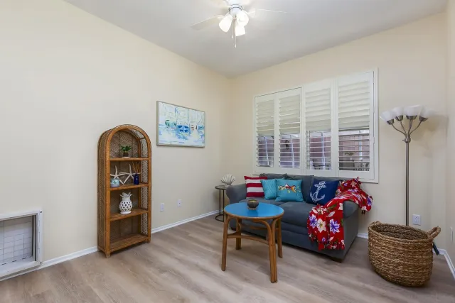 a bedroom with furniture and a window