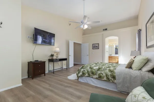 a bathroom with a tub sink and mirror