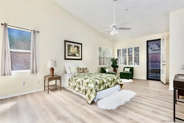 a living room with furniture and a kitchen view