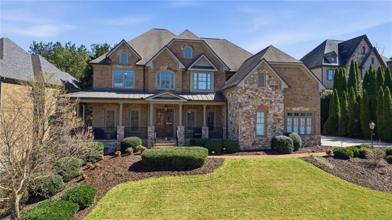 1565 Bramble Bush Way Suwanee, GA 30024 - Photo 1 of 62 a view of a big house with a big yard and potted plants