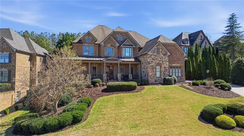 1565 Bramble Bush Way Suwanee, GA 30024 - Photo 2 of 62 a front view of a house with garden