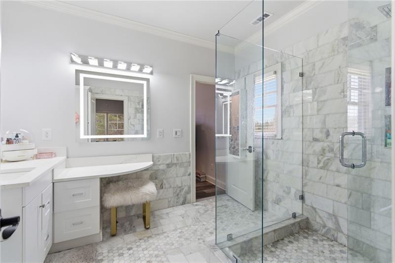 1565 Bramble Bush Way Suwanee, GA 30024 - Photo 23 of 62 a bathroom with a sink a toilet and shower