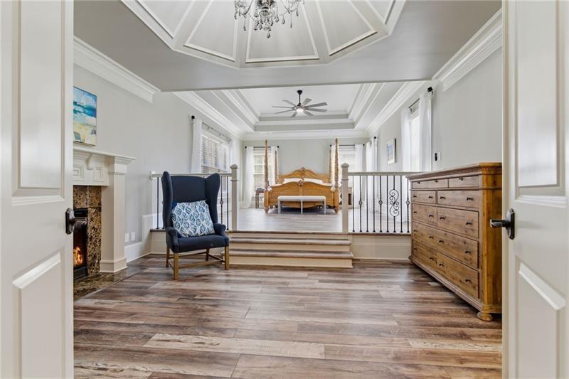 1565 Bramble Bush Way Suwanee, GA 30024 - Photo 27 of 62 a view of entryway livingroom and hall with wooden floor