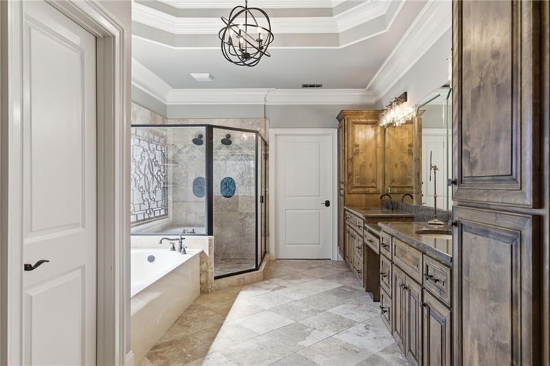 1565 Bramble Bush Way Suwanee, GA 30024 - Photo 31 of 62 a bathroom with a granite countertop sink a mirror and shower