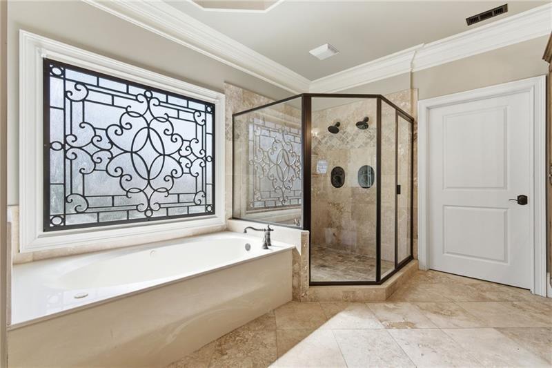 1565 Bramble Bush Way Suwanee, GA 30024 - Photo 33 of 62 a bathroom with a bathtub and a shower