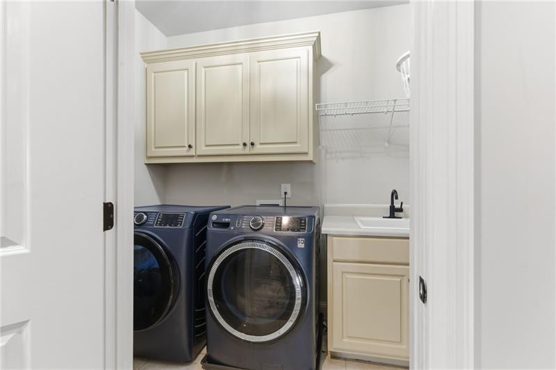 1565 Bramble Bush Way Suwanee, GA 30024 - Photo 47 of 62 a utility room with dryer and washer