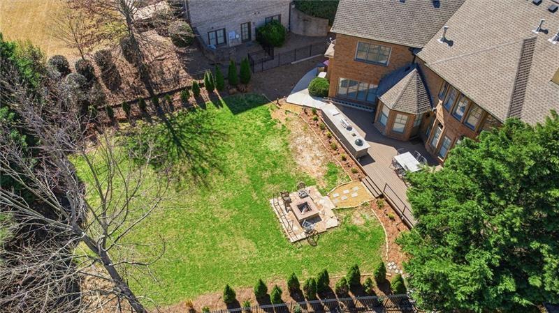 1565 Bramble Bush Way Suwanee, GA 30024 - Photo 50 of 62 an aerial view of a house with garden space and street view