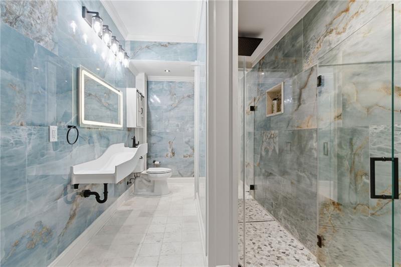 1565 Bramble Bush Way Suwanee, GA 30024 - Photo 53 of 62 a bathroom with a bathtub and a shower