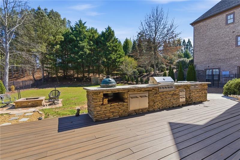 1565 Bramble Bush Way Suwanee, GA 30024 - Photo 57 of 62 a view of a roof deck with couches and wooden floor