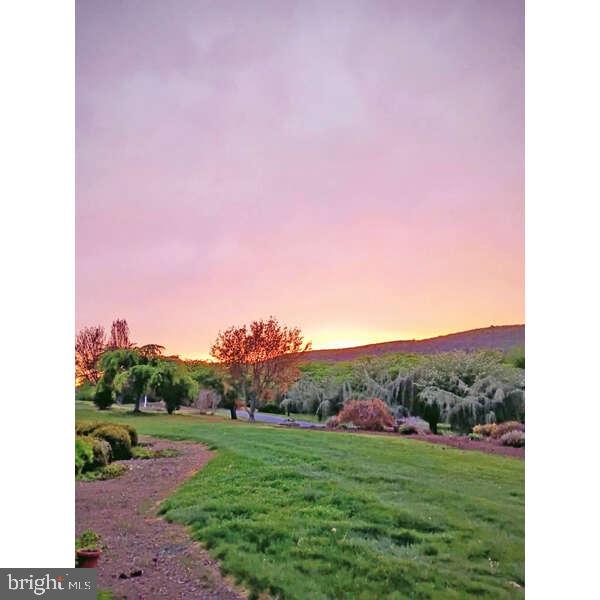 495 Ritchey Road Everett, PA 15537 - Photo 26 of 69 Serene sunset over lush landscape.
