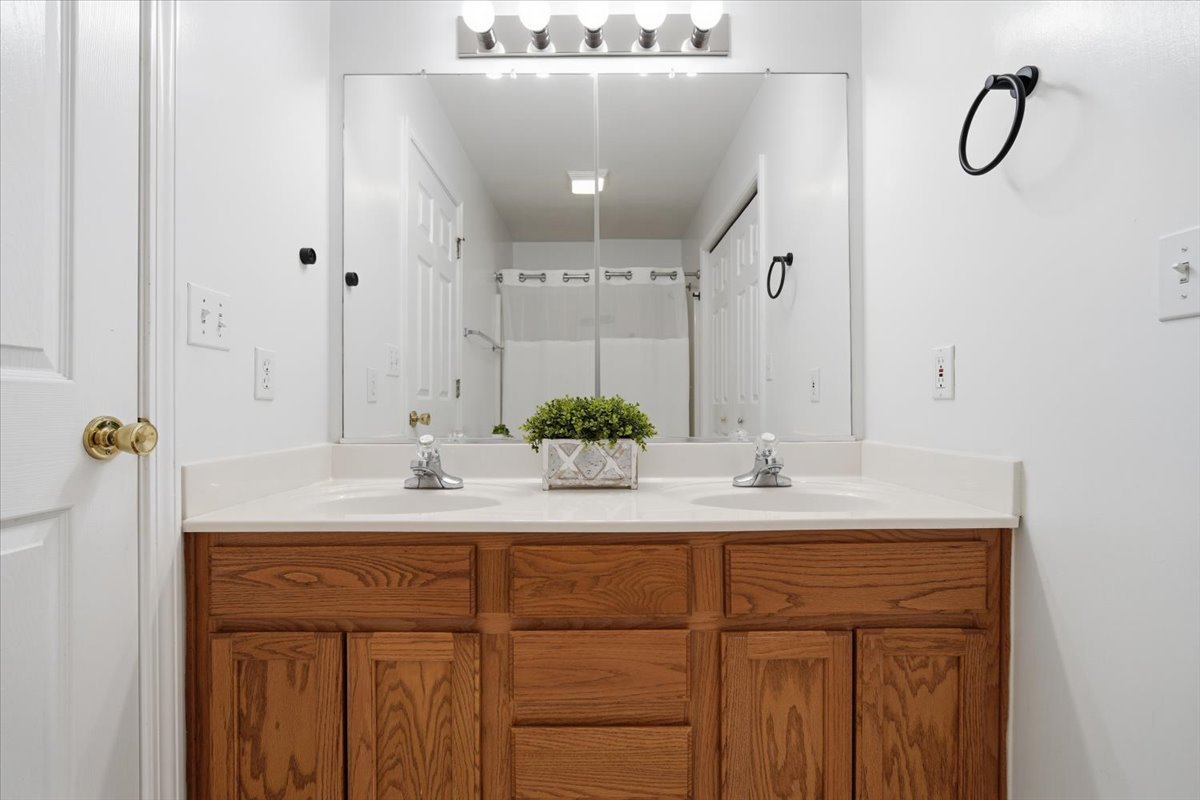 311 Old Farm Road Bloomington, IL 61704 - Photo 19 of 34 a bathroom with a sink and a mirror