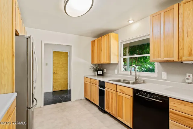 a kitchen with a sink and a window