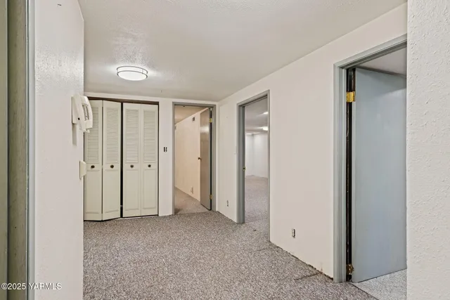 a building outdoor space with patio furniture and potted plants