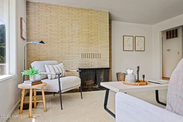 a dining room with a wooden table and chairs