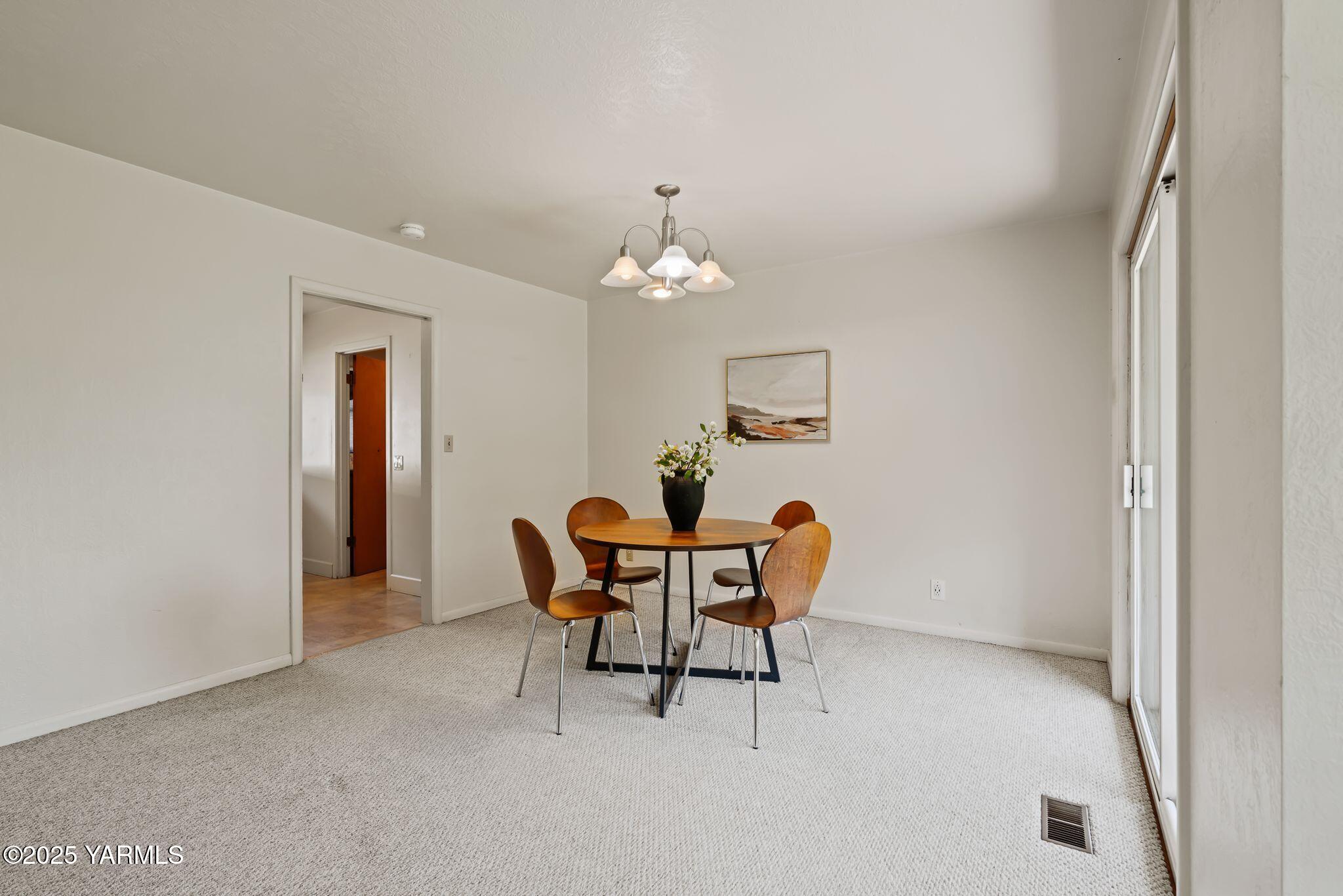 1020 Elm Street Prosser, WA 99350 - Photo 7 of 28 a dining room with furniture and chandelier