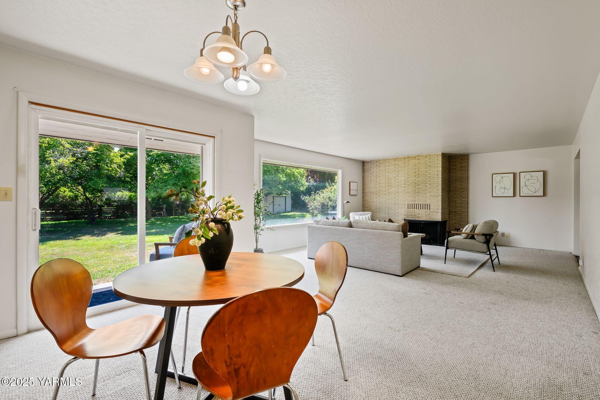 1020 Elm Street Prosser, WA 99350 - Photo 9 of 28 a view of a dining room with furniture window and outside view