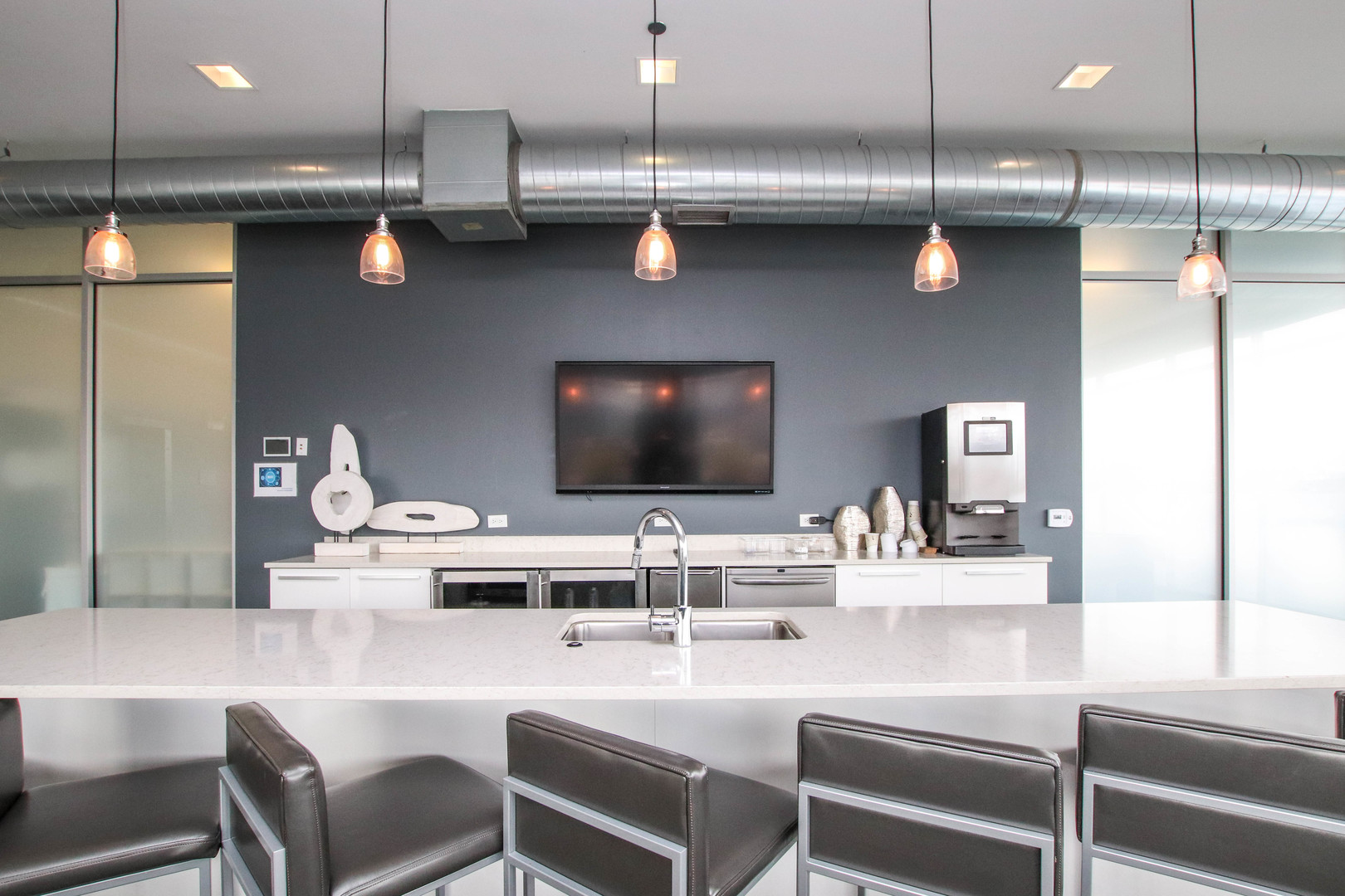 1313 West Randolph Street, Unit 203 Chicago, IL 60607 - Photo 11 of 18 a kitchen with a table and chairs