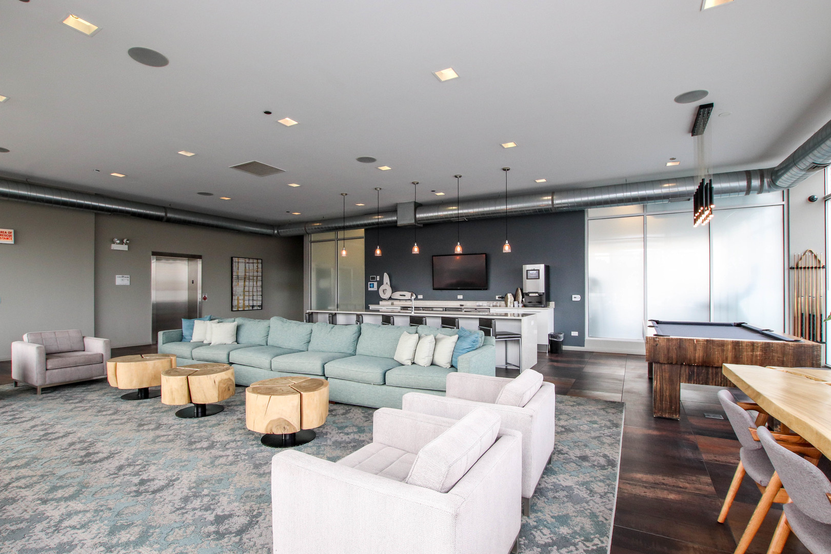 1313 West Randolph Street, Unit 203 Chicago, IL 60607 - Photo 12 of 18 a living room with furniture and a large window