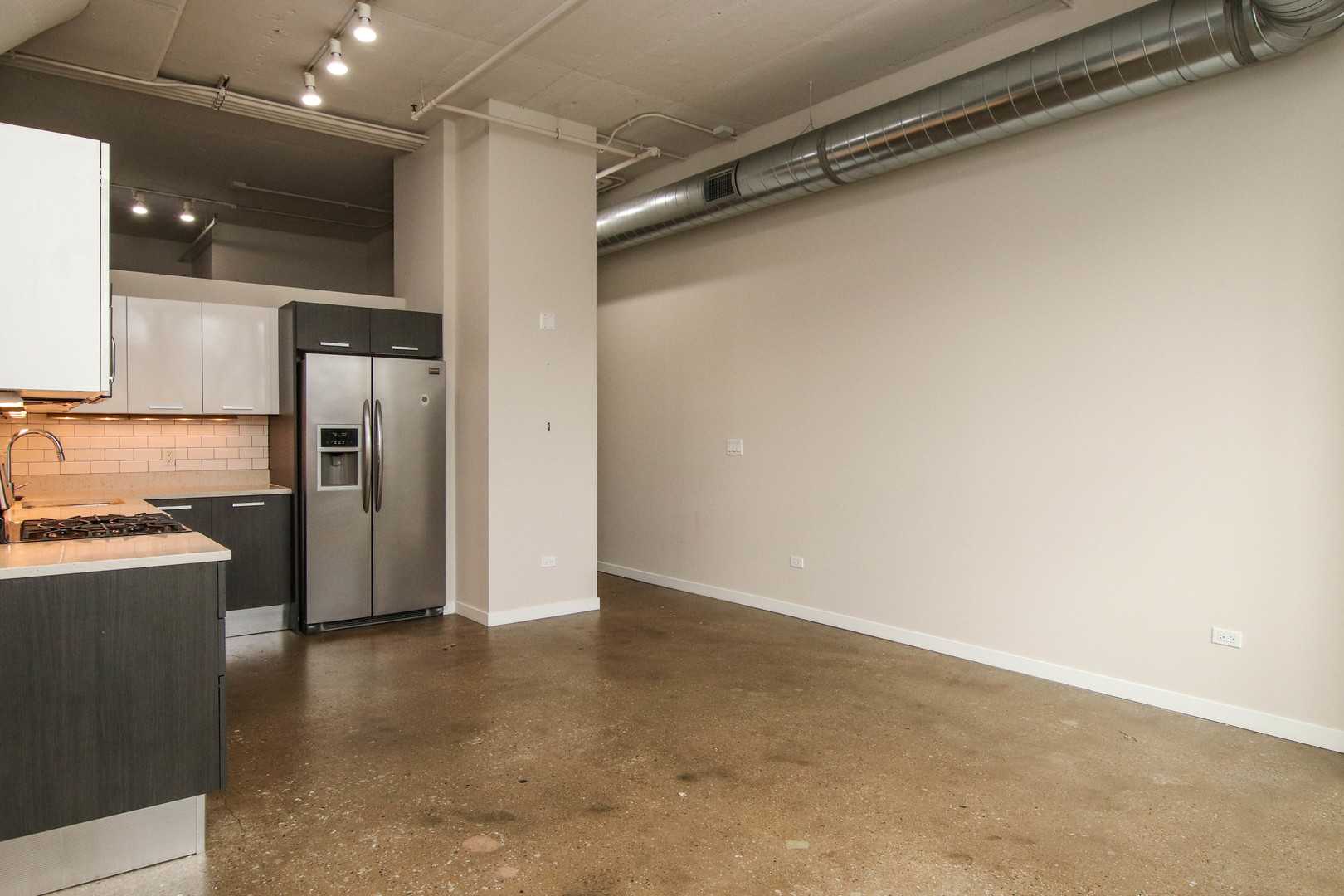 1313 West Randolph Street, Unit 203 Chicago, IL 60607 - Photo 5 of 18 a view of a refrigerator in kitchen