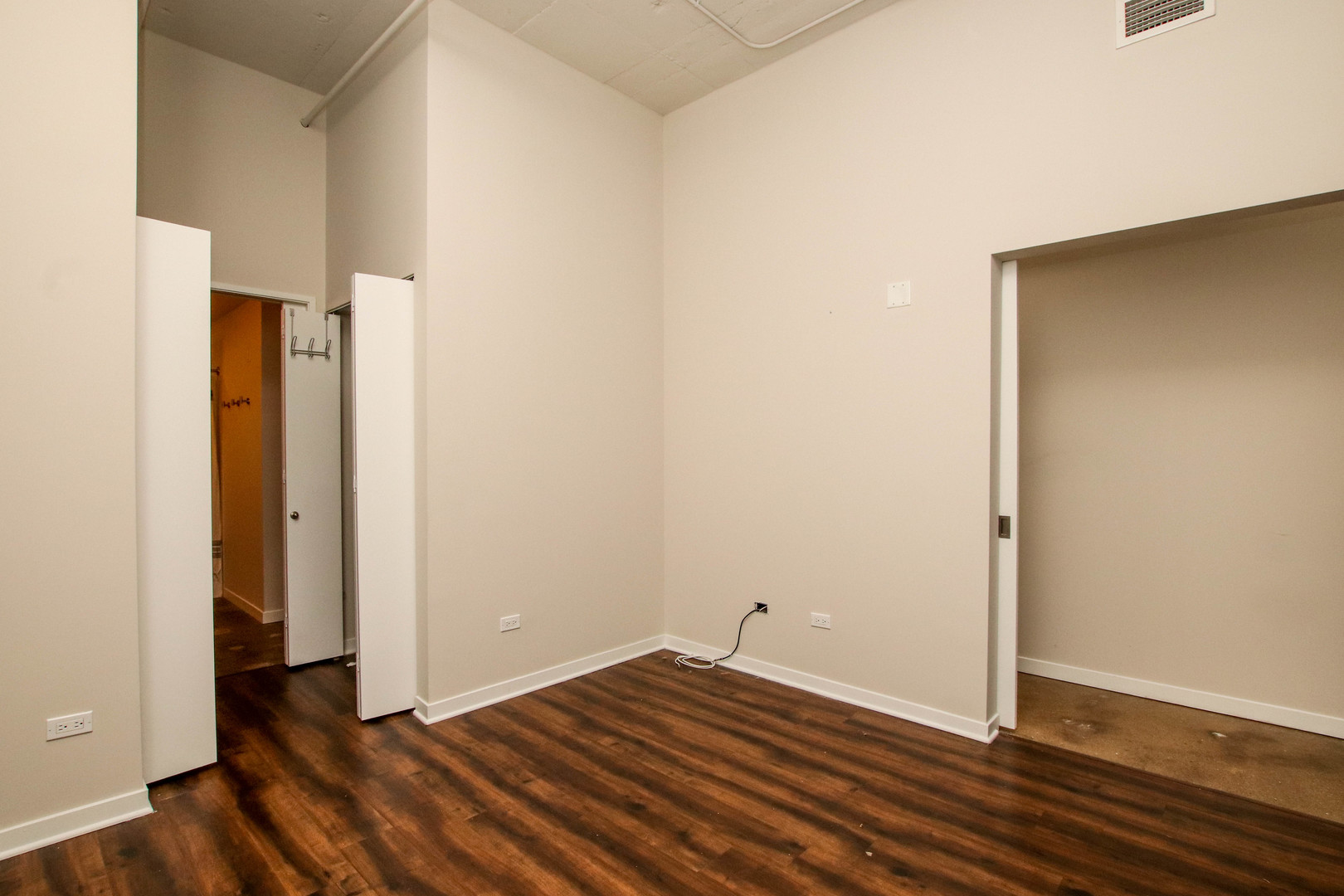 1313 West Randolph Street, Unit 203 Chicago, IL 60607 - Photo 7 of 18 a view of room with wooden floor