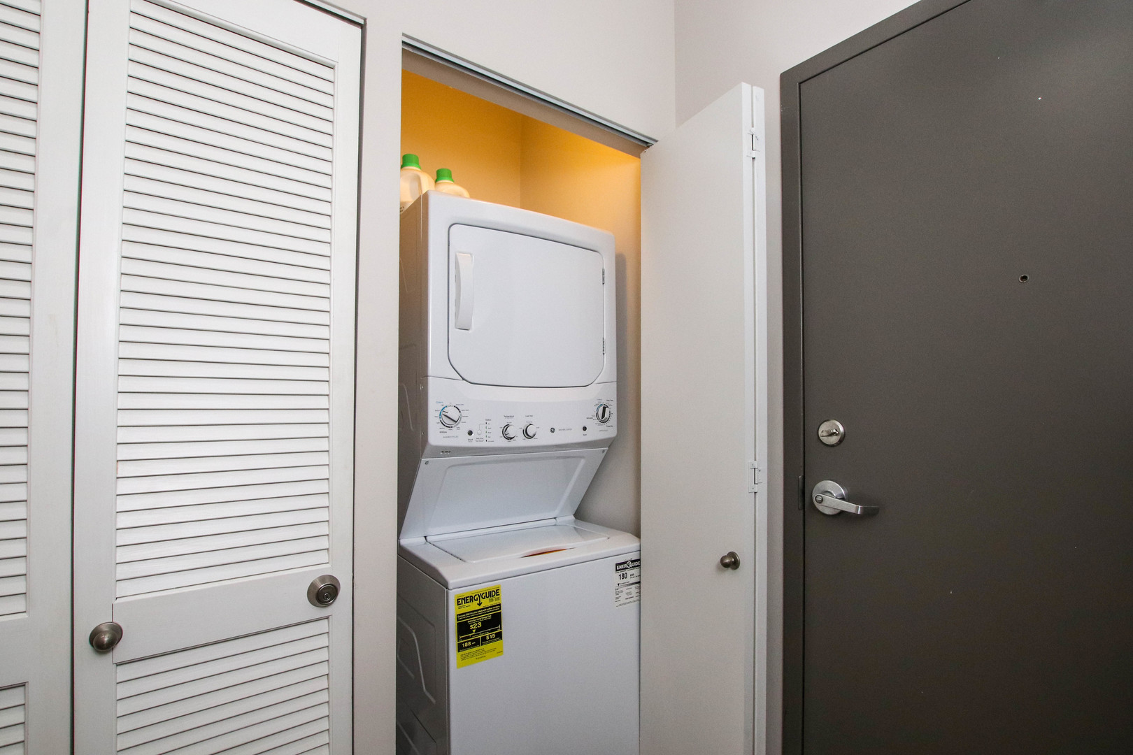 1313 West Randolph Street, Unit 203 Chicago, IL 60607 - Photo 9 of 18 a utility room with dryer and washer